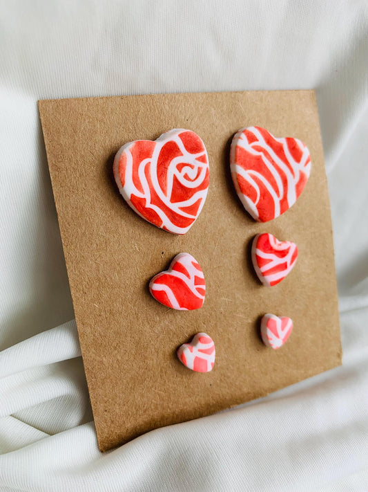 Rose pattern embossed in heart shaped stud earrings in three sizes and three colours