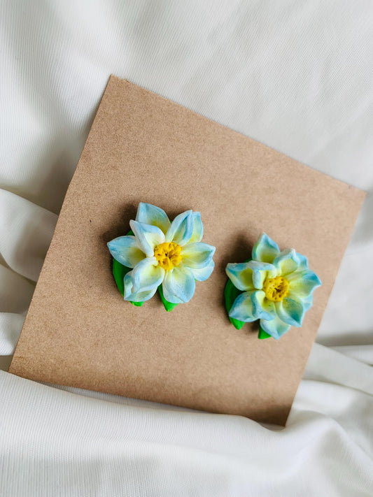 Blue lotus with a lotus leaf stud earrings
