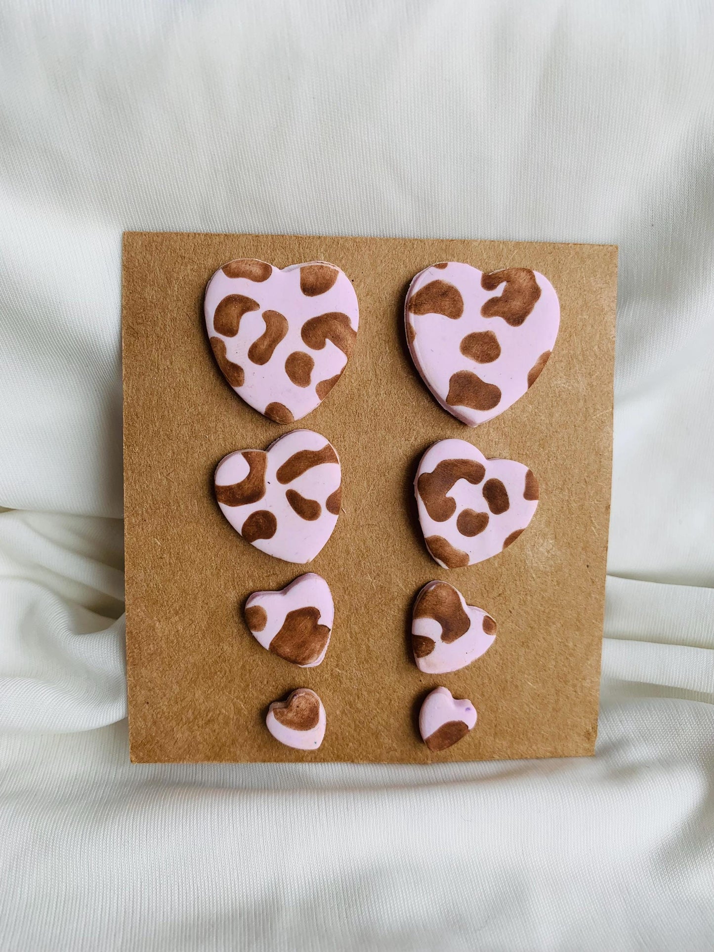 Leopard pattern embossed in heart shaped stud earrings in four sizes