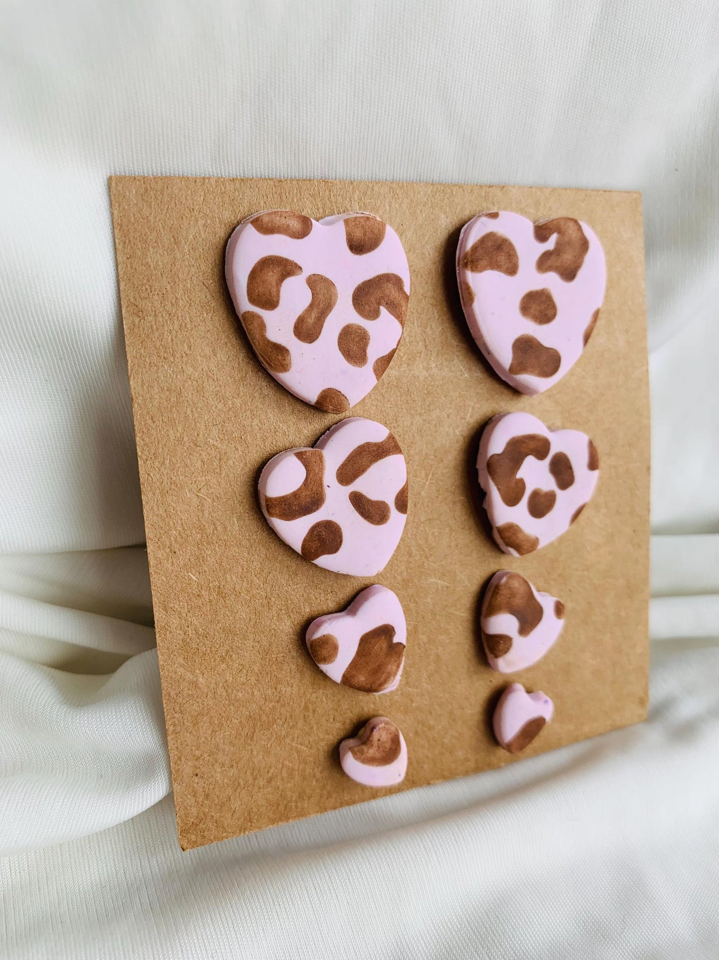Leopard pattern embossed in heart shaped stud earrings in four sizes