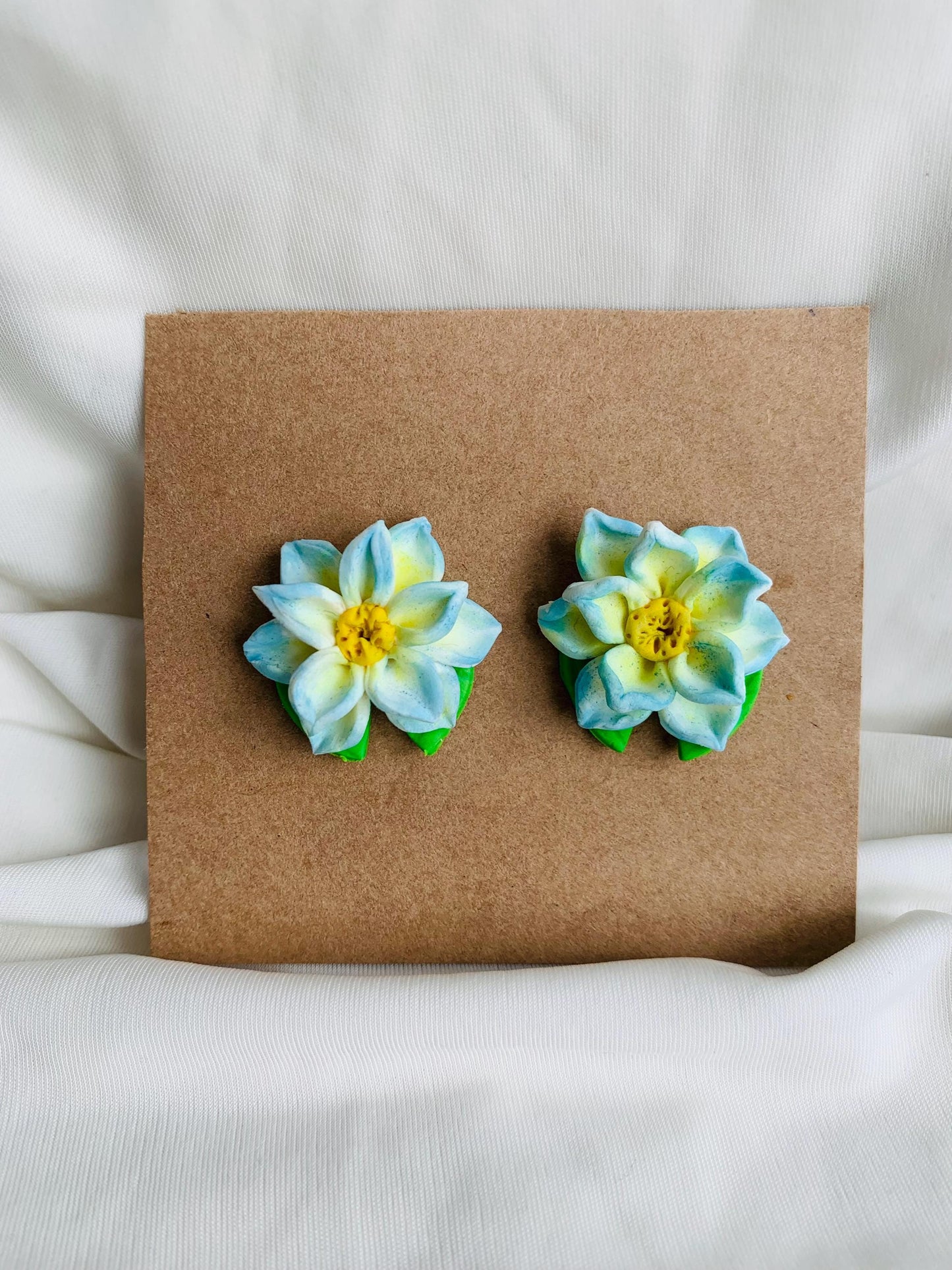 Blue lotus with a lotus leaf stud earrings